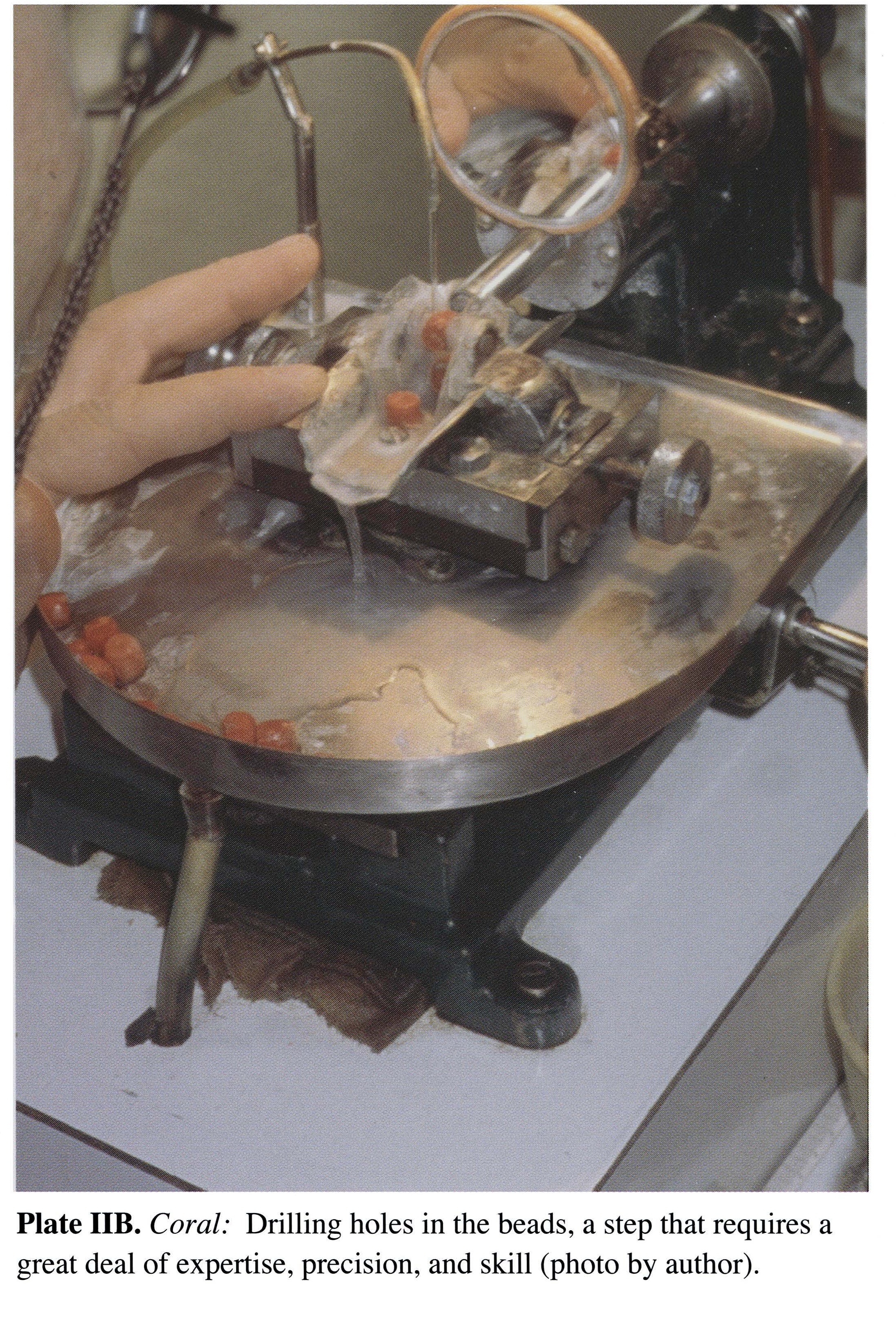 Plate IIB Coral: Drilling holes in the beads, a step that requires a great deal of expertise, precision, and skill (photo by author).